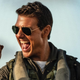 Tom Cruise in his Top Gun costume, pumping his fist.